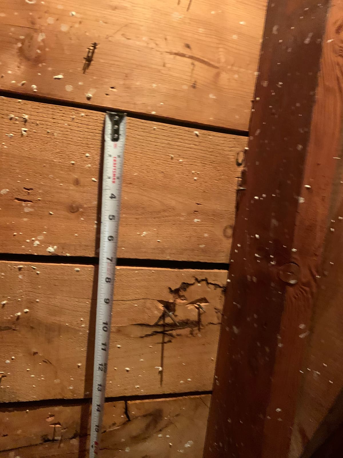 Measuring a split in the decking from inside the attic