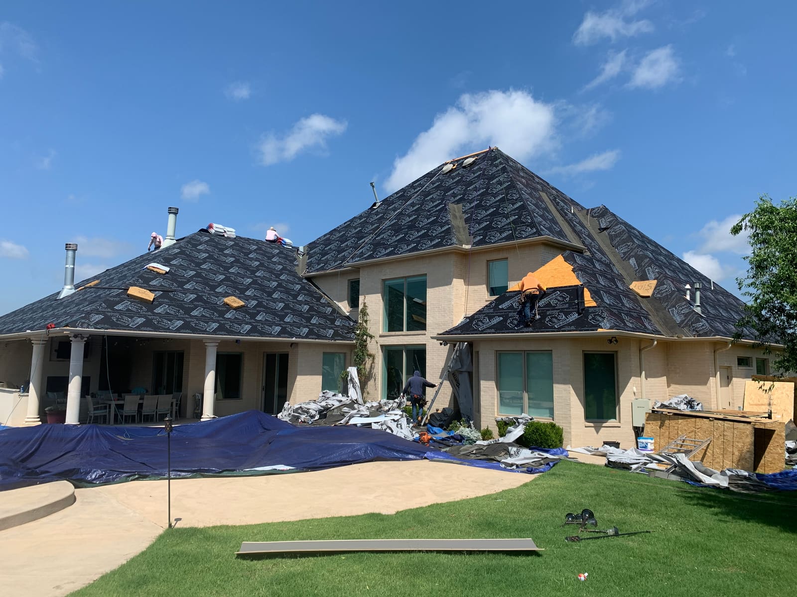 The owner and crew re-roofing a big hip roof, start to finish