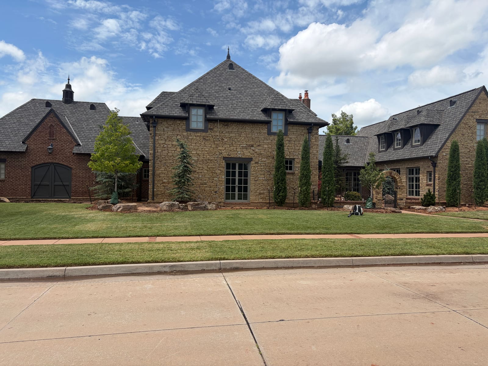 Finished slate roof on a high-end stone home in Oklahoma