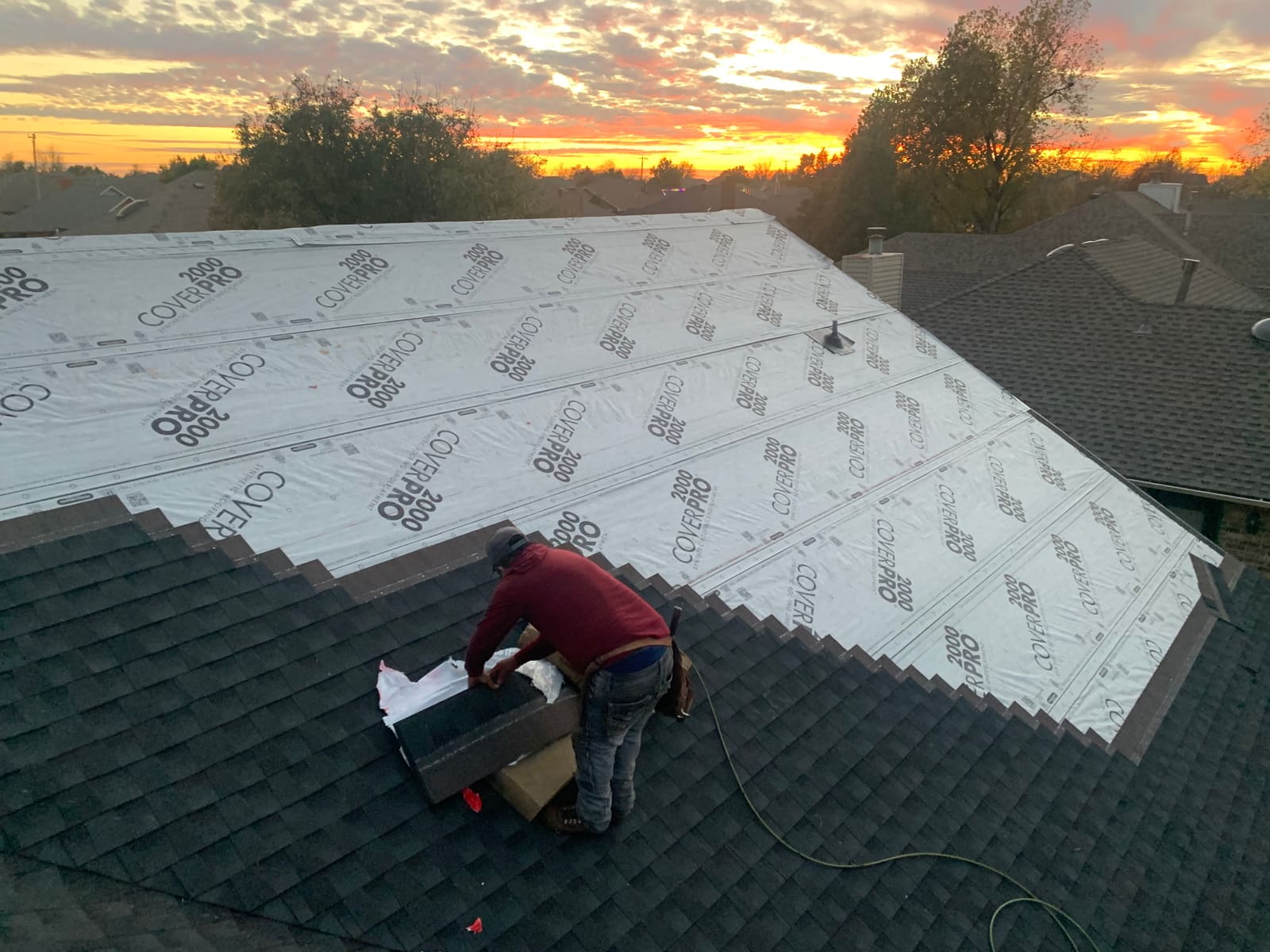 New underlayment down at sunset — dried-in before the next storm rolls in